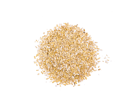 Pile of oat flakes, heap of uncooked ripe oat ears grains, oatmeal, isolated on white background, top view, healthy foodの写真素材