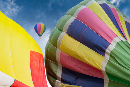 Bright balloons floating in the sky.の写真素材