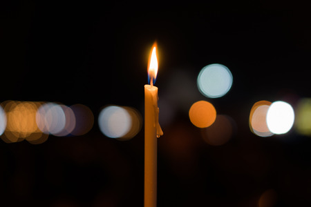 A candels with background of dark and bokeh.の写真素材