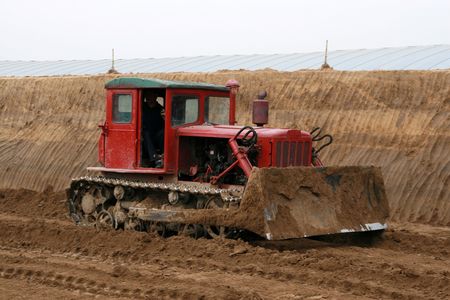 bulldozers is Building  greenhouse vegetables