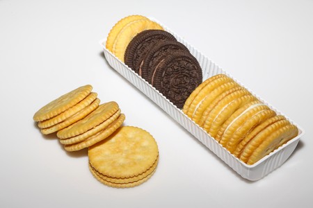 biscuits in a white bowl, in a white background, close up of pictures.