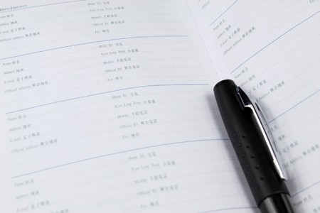 notebook and pen on a white background, close up of picture.の写真素材