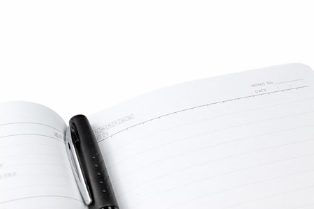 notebook and pen on a white background, close up of picture.の写真素材