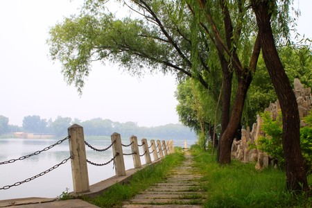 railing and path in the lawn in a park.の写真素材