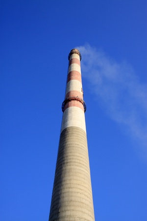 smoke billowed from the chimney in a factory の写真素材
