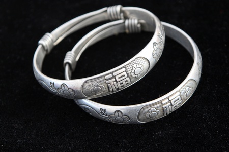closeup of silver bracelet, a kind of female jewelry 