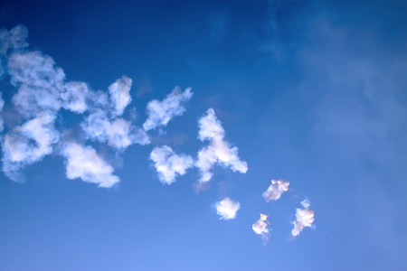 flash and white smoke in the blue sky 