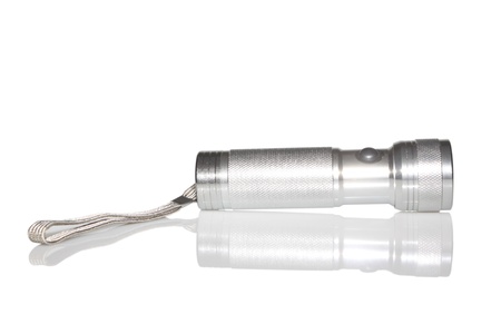 a metal flashlight in white background の写真素材