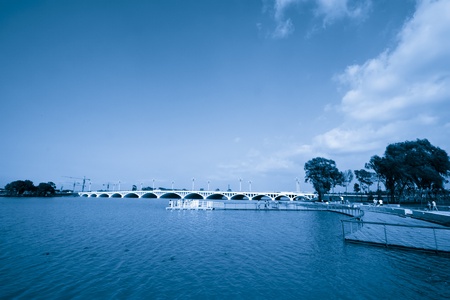 bridge across a river in a parkの写真素材