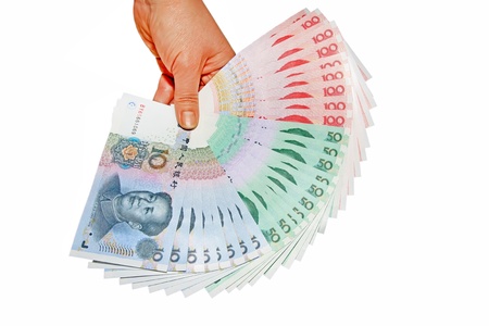 a person's hand who holds a pile of money on the white backgroundの写真素材