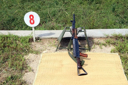 closeup of automatic rifle on the ground
