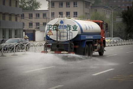watering cart  on the road in the city, north china