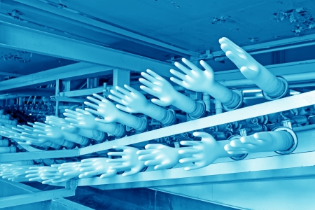 closeup of acrylonitrile butadiene gloves production line in a factory, north china のeditorial素材