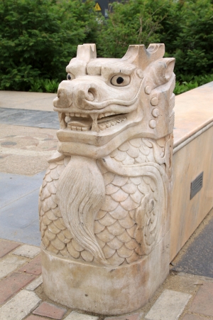 animal model stone sculpture in a park, in the water reflection, in zhangjiakou city, hebei province, China の写真素材