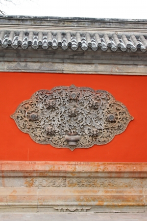Decorative texture in the red wall in the Zhengjue temple in Old summer palace ruins park, Beijing, Chinaの写真素材