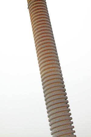 brown metal screw parts on a white background.の写真素材