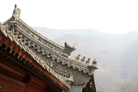 beast sculpture in the eaves in a temple, Chinese traditional  architectural styleの写真素材