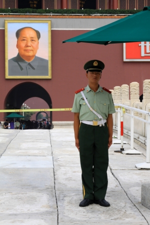 BEIJING - August 29  A soldier stands guard while people visit the Palace Museum on August 29, 2011 in Beijing, China  The collections of the Palace Museum are well protected and are based on Qing imperial のeditorial素材