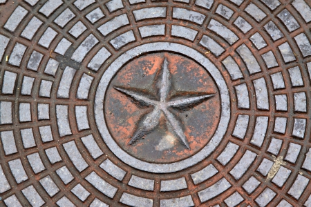 rain drainage well cover in the street of beiing, chinaの写真素材