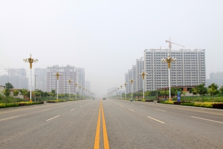 City Road Landscape in the mist, northern chinaの写真素材
