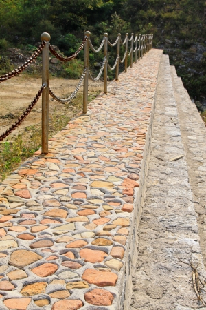 stone ground and iron chain in a parkの写真素材