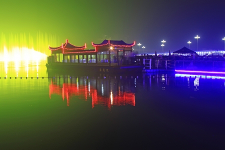 Sightseeing boat on the shore in a park, north chinaのeditorial素材