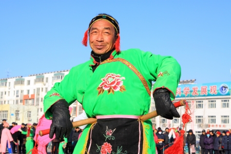 Luannan County, February 2  people wearing colorful clothing, with various props, dressed up as...