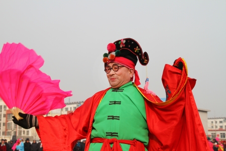 Luannan County, February 3  people wearing colorful clothing, with various props, dressed up as various characters, performing in the streets in yangko dance, to celebrate the arrival of the Spring Festival, in February 3, 2012, Luannan County, Hebei Provのeditorial素材