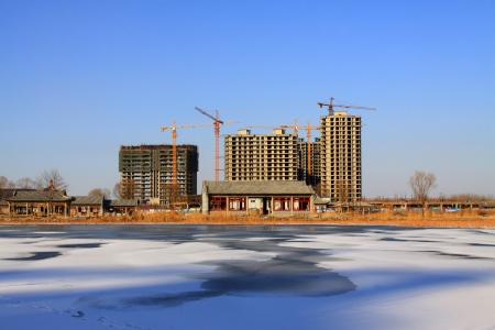 Unfinished construction site in the ice river edge, North Chinaの写真素材