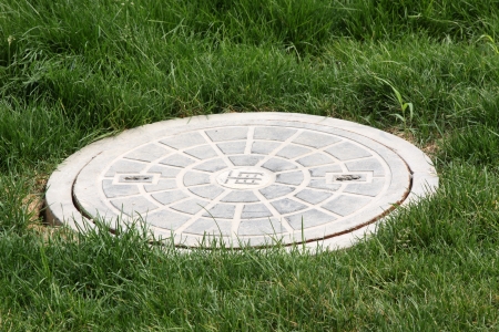Municipal sewage manhole cover in a park north chinaの写真素材