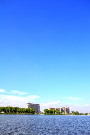 unfinished building under the blue sky by the river, north chinaの写真素材