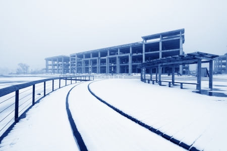 buildings and railing in the snow, at a construction siteのeditorial素材