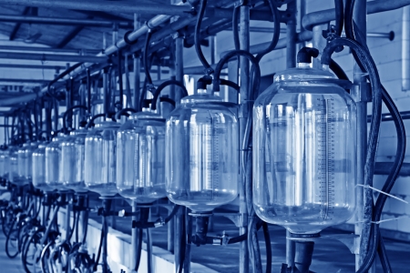 glass milk storage tank in a milking workshop, luannan county, chinaの写真素材