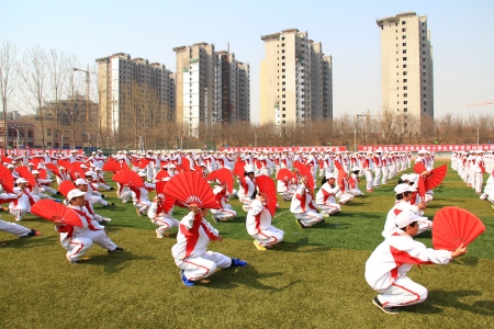 LUANNAN - APRIL 16  Regiment gymnastics performance on the playground in a middle school Games opening ceremony on April 16, 2013, Luannan, Hebei Province, china のeditorial素材