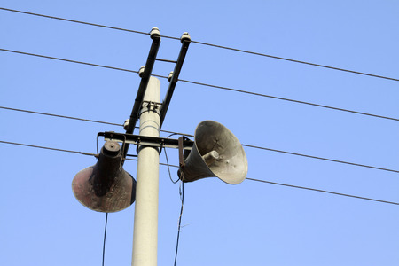 loudspeaker on wire poles in rural, China の写真素材