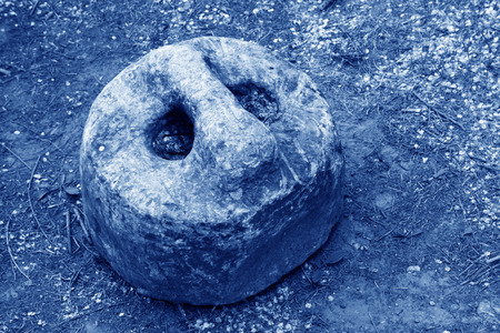 broken stone lock in the grass, closeup of photoの写真素材