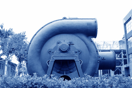 huge gray mechanical equipment in an industrial park, closeup of photo