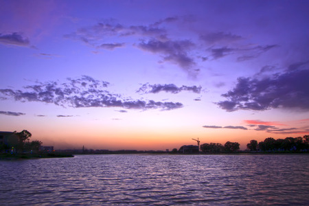 beautiful clouds over the river at night, closeup of photoの写真素材