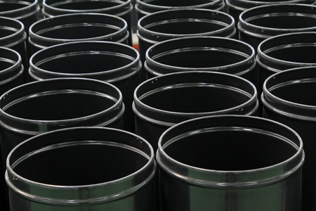 Black stainless steel barrels put together in a workshop