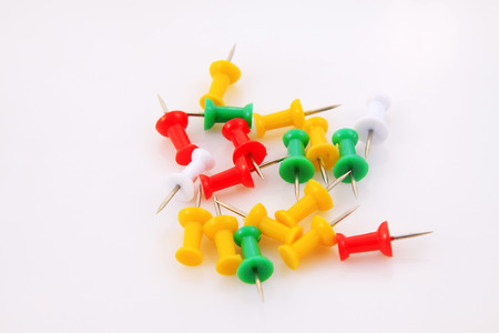 color drawing pin on white background