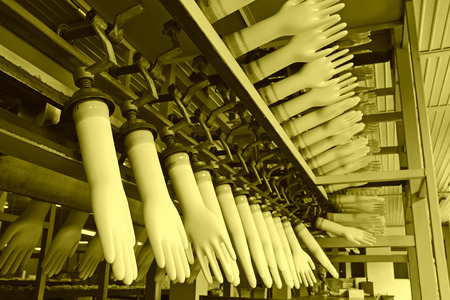 closeup of acrylonitrile butadiene gloves production line in a factory, north china  のeditorial素材