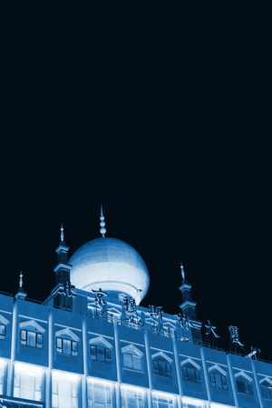 BEIJING - August 29: Beijing Muslim Building in Wangfujing street on August 29, 2011 in Beijing, china.  It located in the heart of the Beijing Wangfujing business district, is an open up a fresh outlook, large construction, building a total of ten floorsのeditorial素材