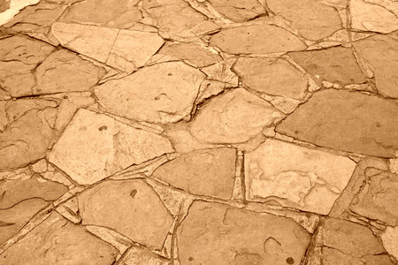 gray stone ground in a park, looks very old 
