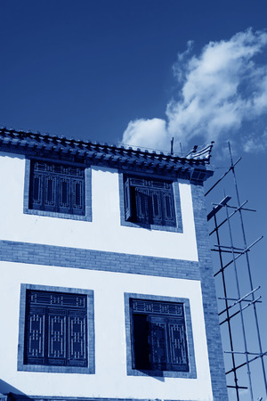 scaffolding and unfinished antique building, north chinaのeditorial素材