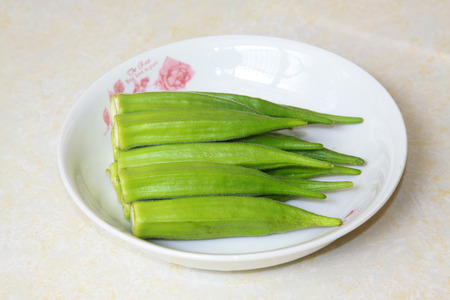 Okra in the dish, closeup of photoの写真素材