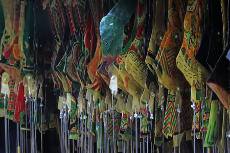 Chinese shadow play props hanging in the night, closeup of photoの写真素材
