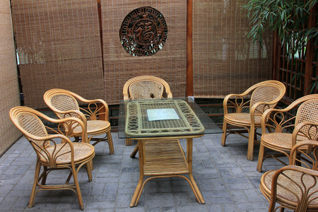 Bamboo chair and glass tea table, closeup photoのeditorial素材