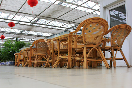 Bamboo chair and glass tea table, closeup photoのeditorial素材