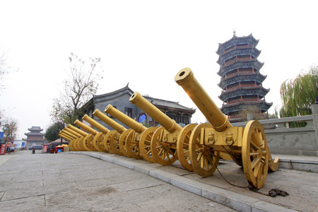 LUAN COUNTY - NOVEMBER 23: Copper artillery and antique buildings in Luanzhou city, on november 23, 2014, Luan County, Hebei Province, Chinaのeditorial素材