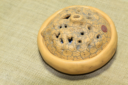 Ceramic smoked incense burner, closeup of photo